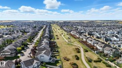 Expansive aerial showcasing a residential community with numerous single-family homes - 
