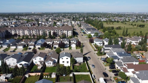 Residential street with single-family homes and apartment complexes - 3525 22 St Nw, Edmonton, AB 