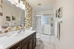 White vanity countertop with an integrated oval sink and chrome faucet - 