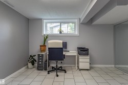 Recessed window with white trim, light gray walls, tile flooring, and mirrored closet doors - 