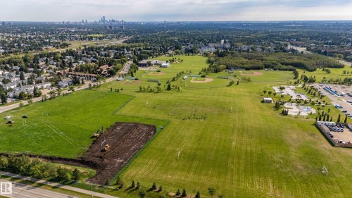 Expansive green spaces featuring multiple sports fields, baseball diamonds, and surrounding residential areas - 7408 180 Street Nw, Edmonton, AB 