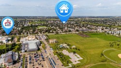 Expansive open green spaces, athletic fields, and a community park with recreational features - 