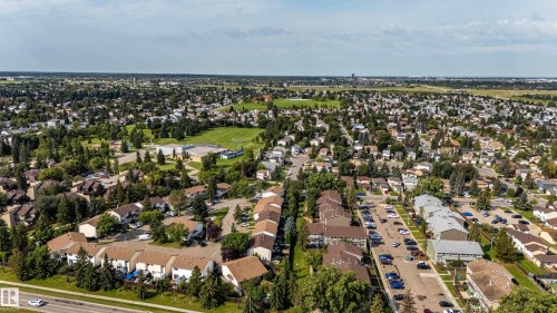 Expansive residential area featuring a mix of housing styles, mature trees, and green spaces - 7408 180 Street Nw, Edmonton, AB 