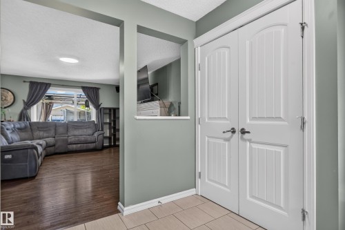 Panel-style double doors, wood-finish flooring, and recessed ceiling lighting - 1332 72 Street Sw, Edmonton, AB 