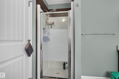 Shower enclosure with a frosted glass panel and chrome frame - 1332 72 Street Sw, Edmonton, AB 