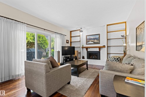 Spacious family room with gas fireplace (2025) - 11118 23A Avenue Nw, Edmonton, AB 