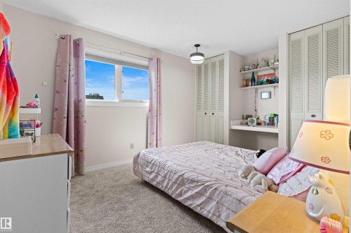 Second bedroom is very generous in size with 2 closets and built-in desk. - 11118 23A Avenue Nw, Edmonton, AB 