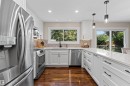 New kitchen 2026. Custom cabinets, quartz countertops, ceramic tile backsplash, stainless steel appliance. - 11118 23A Avenue Nw, Edmonton, AB 