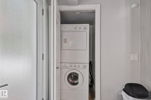 Stackable washer and dryer unit within a dedicated kitchen closet - 18812 89 Avenue Nw, Edmonton, AB 