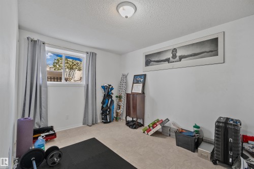 Recessed lighting with a white dome fixture illuminates the room - 18812 89 Avenue Nw, Edmonton, AB 