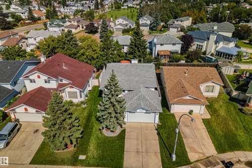 Suburban residential setting with mature trees and paved driveways - 18812 89 Avenue Nw, Edmonton, AB 