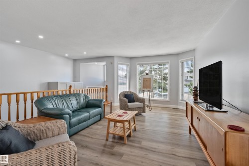 Recessed lighting illuminates the wood-finish flooring - 18812 89 Avenue Nw, Edmonton, AB 