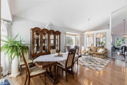 Hardwood flooring throughout, vaulted ceilings, bay window, and chandelier lighting - 522 Klarvatten Lake Wynd Nw, Edmonton, AB 