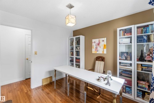 Wood-finish flooring, recessed lighting, and built-in glass-front cabinetry - 522 Klarvatten Lake Wynd Nw, Edmonton, AB 