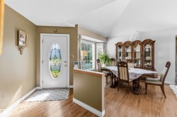 Entryway featuring a decorative glass-insert door - 