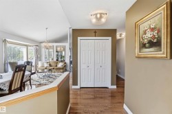 High ceilings, wood-finish flooring, white paneled bifold doors, and recessed lighting fixtures - 
