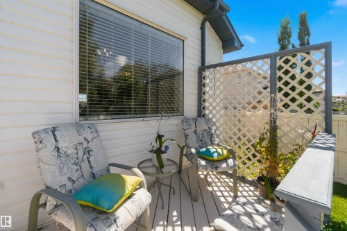 Deck with perimeter railing, privacy lattice, and exterior siding - 522 Klarvatten Lake Wynd Nw, Edmonton, AB 