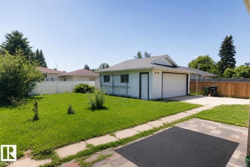 Spacious single-story residence with modern architectural lines and large windows positioned on a level lot - 10439 36A Ave Nw, Edmonton, AB 