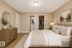 Recessed ceiling lighting, wood-finish flooring, built-in closet, vanity with undermount sink, and wall-mounted light fixture - 