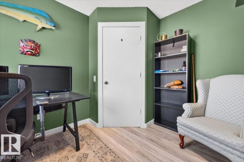 Light wood-finish flooring with a textured ceiling - 1217 76 Street Sw, Edmonton, AB 
