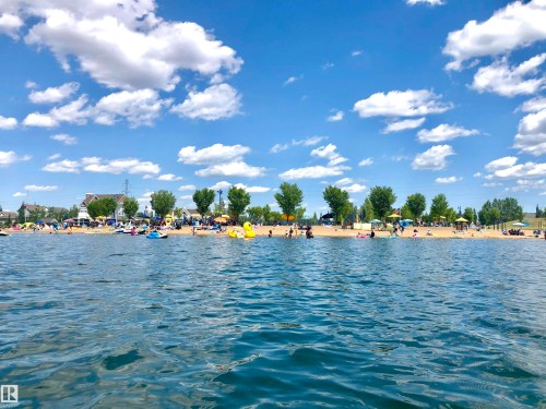 Sandy beach shoreline with mature trees and waterfront access - 1217 76 Street Sw, Edmonton, AB 
