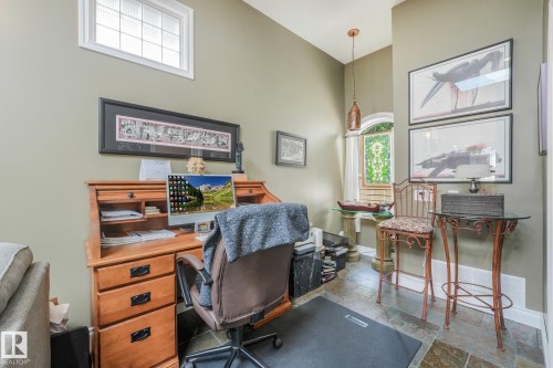 Vaulted ceiling, transom window, arched window, slate-finish flooring, and a built-in wood-finish desk - 10531 137 Street Nw, Edmonton, AB 