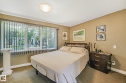 Large window with vertical blinds, ceiling-mounted light fixture - 