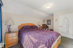 2nd bedroom is Carpeted room with sloped ceilings, - 