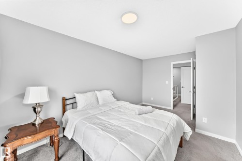 Recessed ceiling light fixture, neutral wall color, and carpeted flooring - 479 39 St Sw, Edmonton, AB 