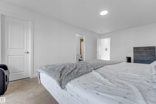 Recessed lighting, white paneled doors, and neutral wall tones - #62 2710 66 St Sw, Edmonton, AB 