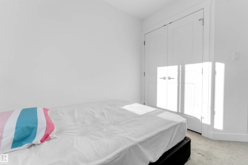 White walls, white doors, and light-colored carpeting - #62 2710 66 St Sw, Edmonton, AB 