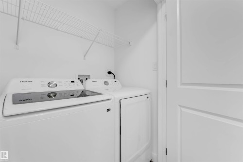 Built-in wire shelving, white paneled door - #62 2710 66 St Sw, Edmonton, AB 