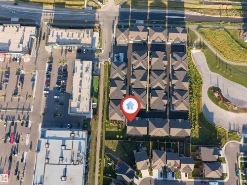 Townhome community featuring consistent roofing materials and structured layouts - #62 2710 66 St Sw, Edmonton, AB 