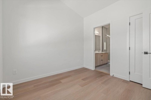 Vaulted ceiling with wood-finish flooring - 15020 90 Avenue Northwest, Edmonton, AB 