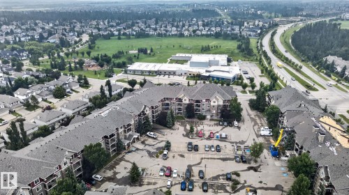 Expansive aerial perspective showcasing a multi-building residential complex with ample parking areas - #335 2096 Blackmud Creek Dr Sw, Edmonton, AB - Outdoor With View