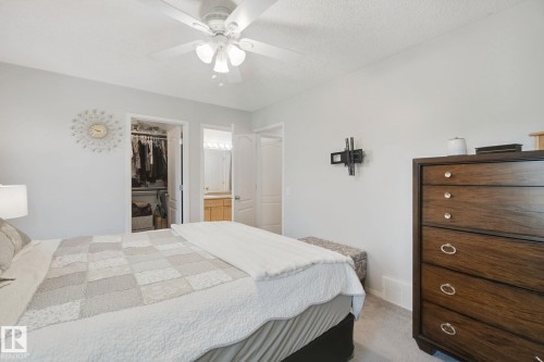 Ceiling fan, wall-mounted television bracket, and carpeted flooring - 15618 141 Street Nw, Edmonton, AB 