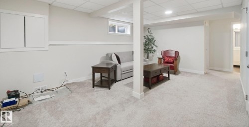 Recessed lighting, light gray carpeting, and painted white walls - 15618 141 Street Nw, Edmonton, AB 