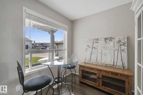 Large window with white trim, hard-surface flooring, and neutral wall tones - 15618 141 Street Nw, Edmonton, AB 