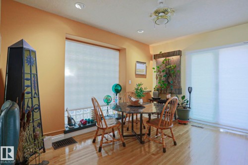 Recessed lighting, ceiling fan, wood-finish flooring, and large windows with blinds - 10814 125 Street Nw, Edmonton, AB 