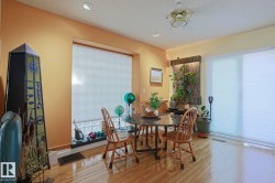 Recessed lighting, ceiling fan, wood-finish flooring, and large windows with blinds - 