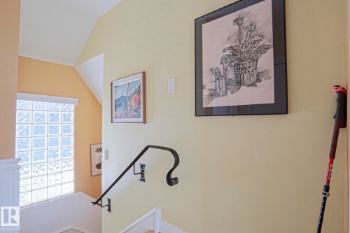 Glass block window, wrought iron handrail, white wainscoting, vaulted ceiling - 10814 125 Street Nw, Edmonton, AB 