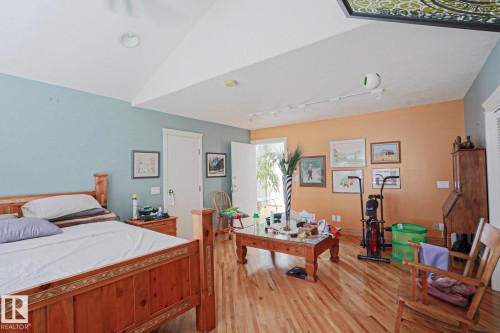 Wood-finish flooring, white doors, and recessed lighting - 10814 125 Street Nw, Edmonton, AB 