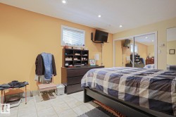 Recessed lighting, tile flooring, window with blinds, and mirrored sliding closet doors - 