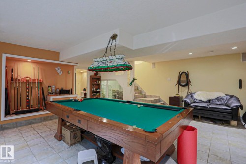 Recreation area with tile flooring and a built-in cue rack - 10814 125 Street Nw, Edmonton, AB 