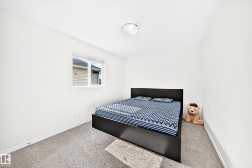 Carpeted flooring, white walls, and a single window with blinds - 2015 Chalmers Way Sw, Edmonton, AB 