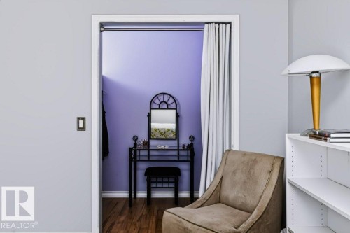 Closet with wood-finish flooring and a built-in hanging rod - 18431 95A Avenue Nw, Edmonton, AB 
