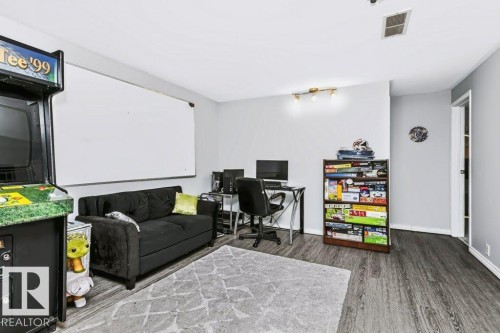 Wood-finish flooring, recessed lighting, and a neutral color palette - 18431 95A Avenue Nw, Edmonton, AB 