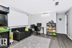 Wood-finish flooring, recessed lighting, and a neutral color palette - 