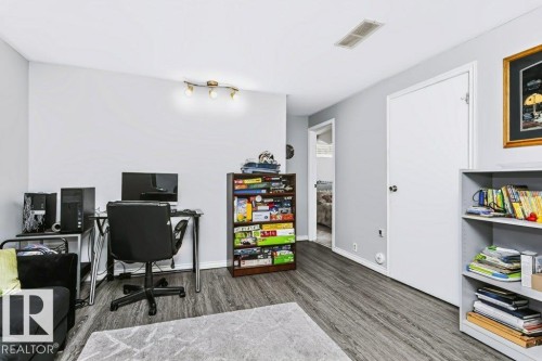 Wood-finish flooring throughout the room - 18431 95A Avenue Nw, Edmonton, AB 