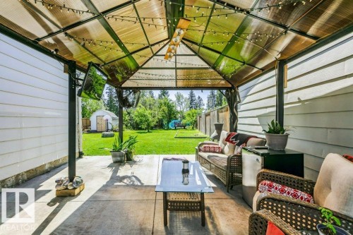 Covered patio with durable concrete flooring - 18431 95A Avenue Nw, Edmonton, AB 